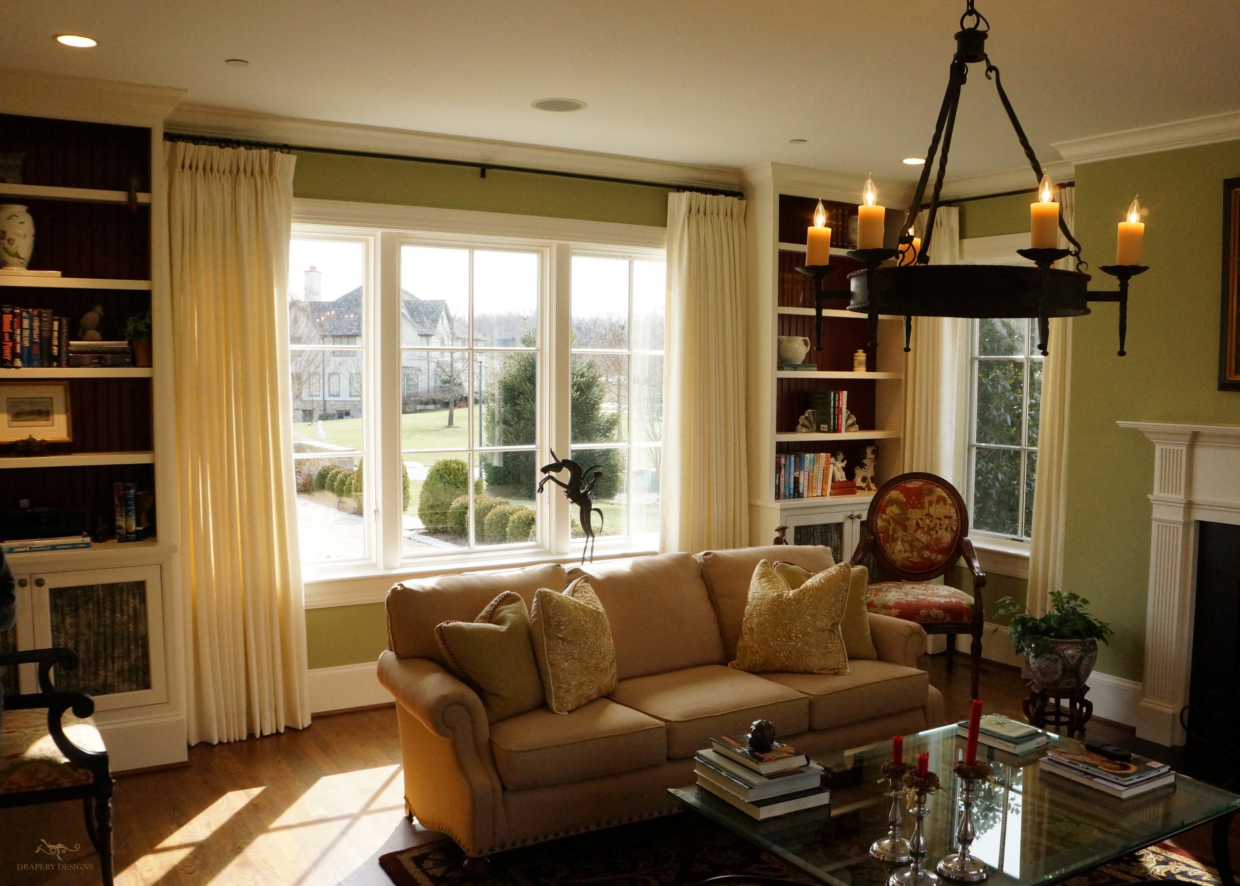 lined white panels on 1" metal rods in family room.