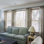 Family room beige curtains on small metal rods