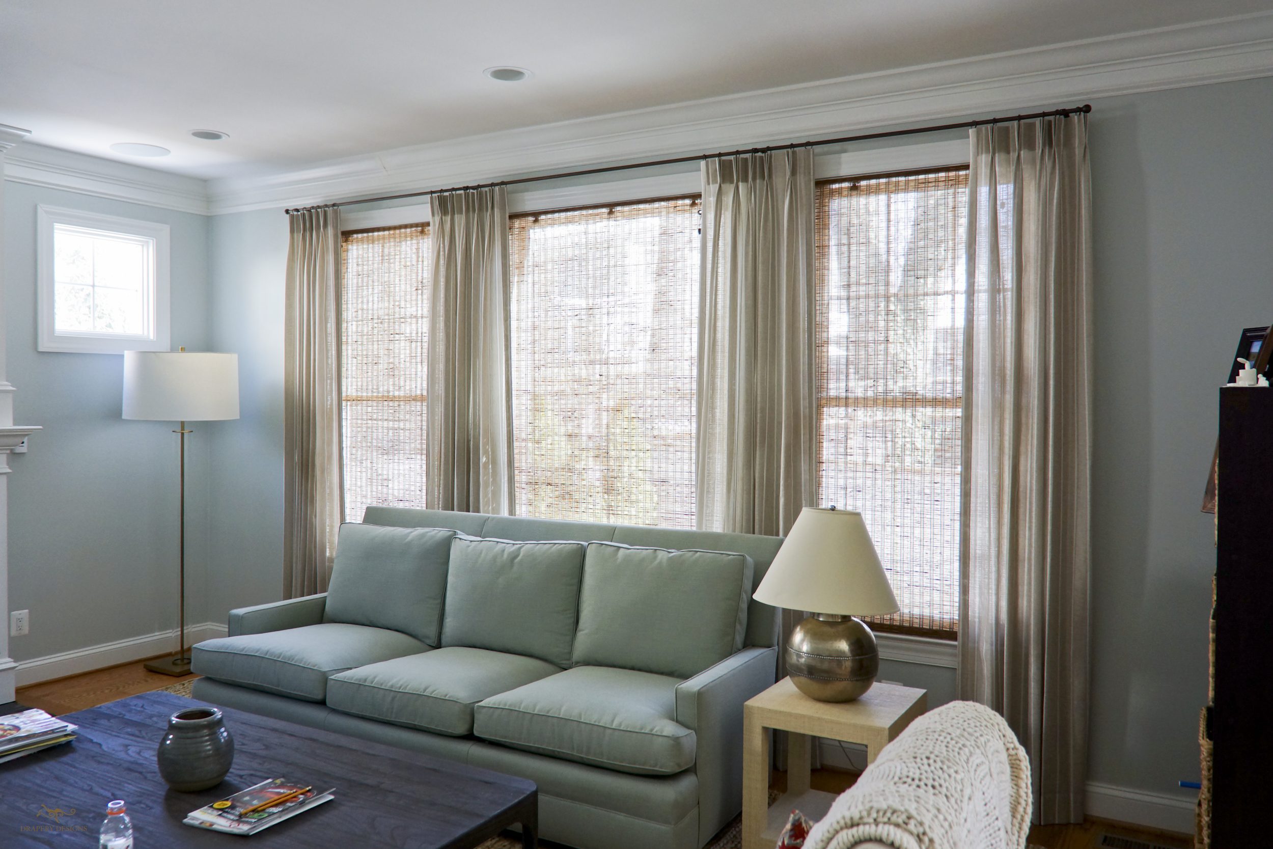 Family room beige curtains on small metal rods