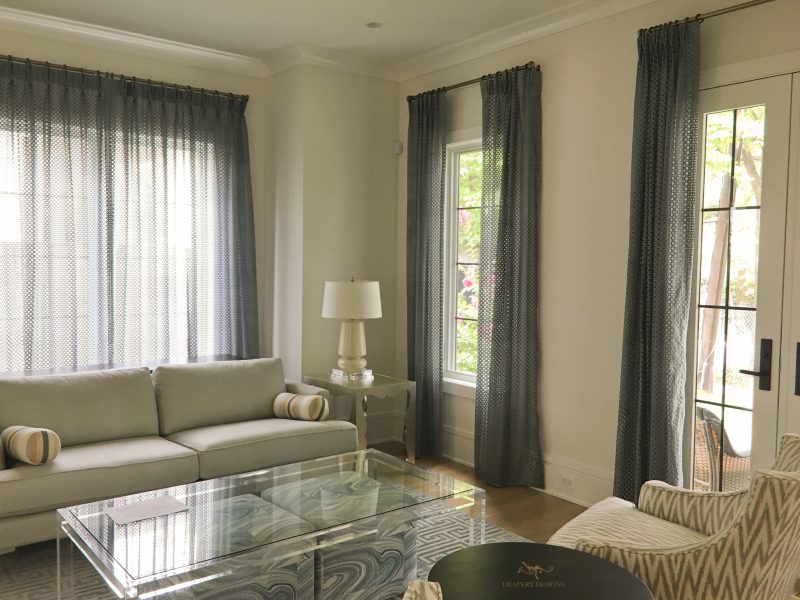Grey curtains on metal rods, unlined sheer panels,