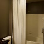 White Shower Curtain with ceiling mounted rod