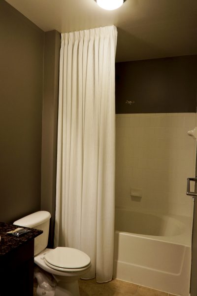 White Shower Curtain with ceiling mounted rod